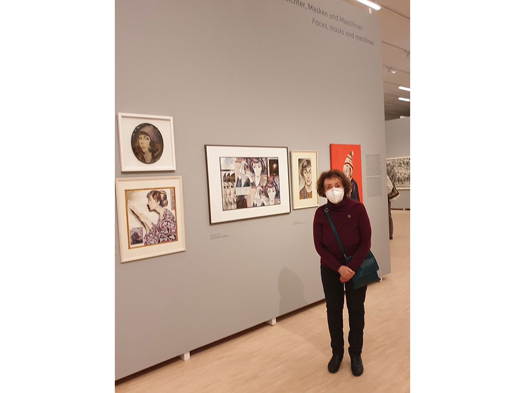 NinaWR in front of her paintings in the exhibition in March 2021